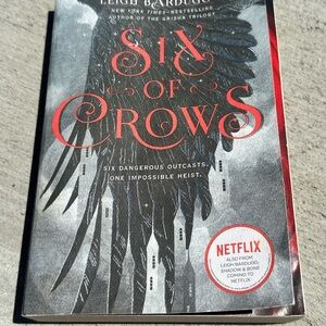 Six of Crows Paperback Novel with Black & Red Cover